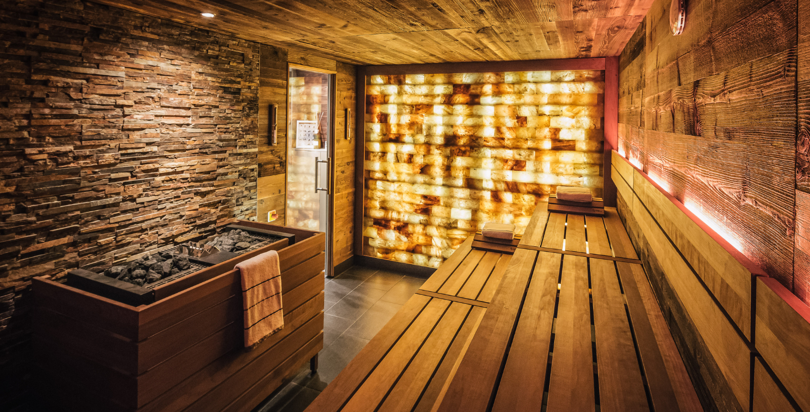 a room with a sauna and a bench