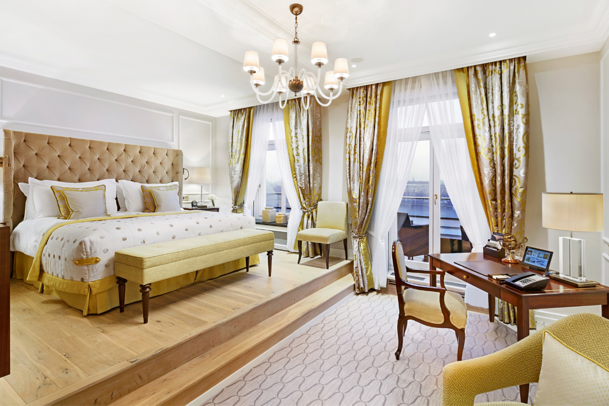 a room with a bed and a desk