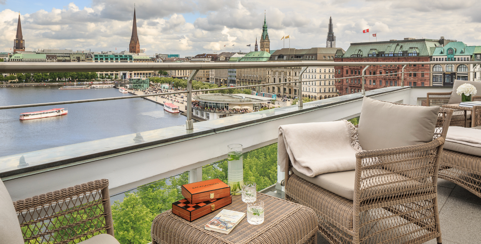 a balcony with a view of a city and a river