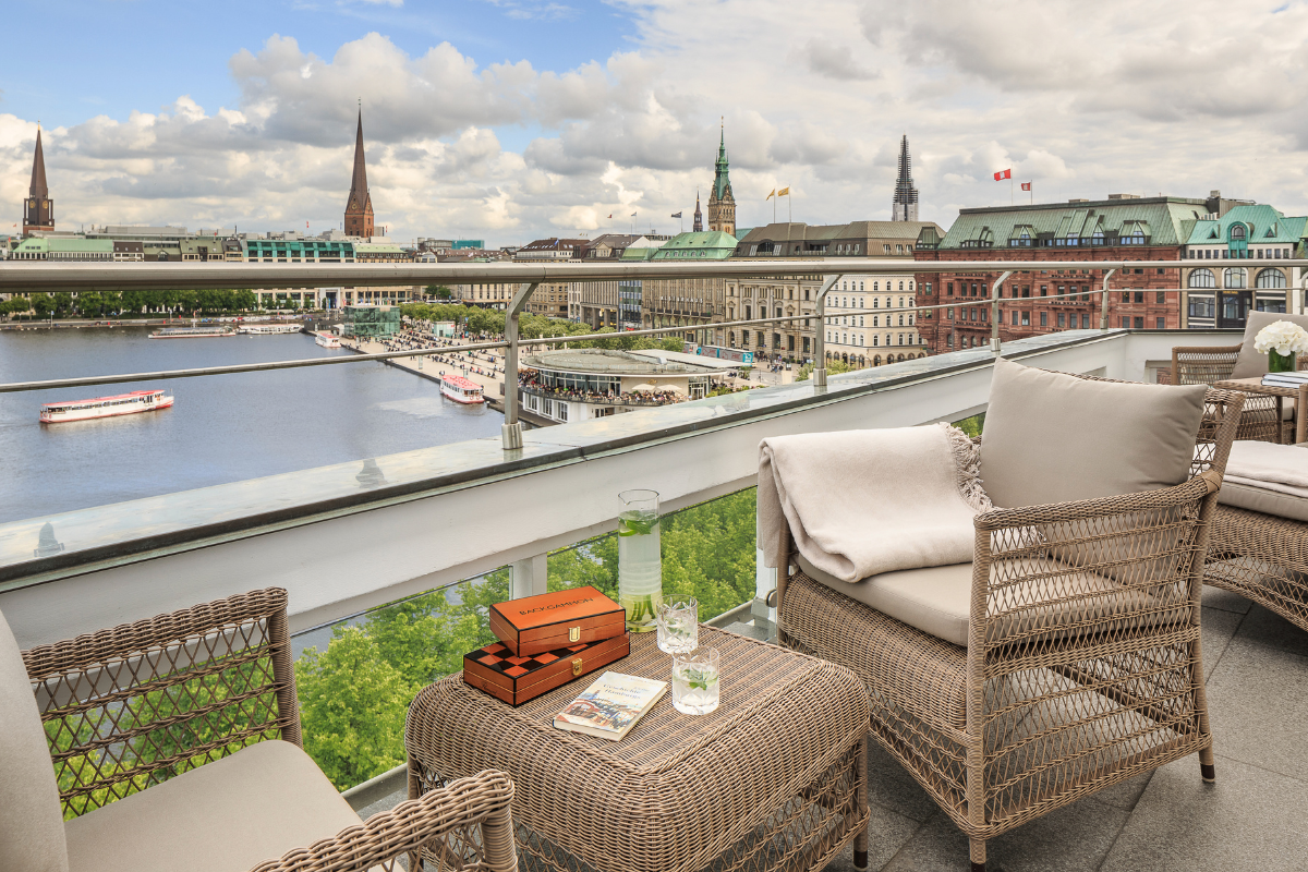 a balcony with a view of a city and a river