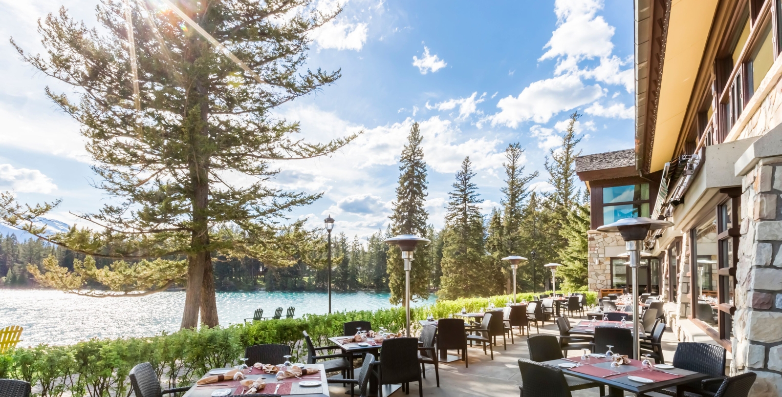 a restaurant with tables and chairs and trees