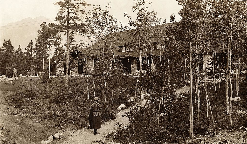 a woman walking on a path in the woods