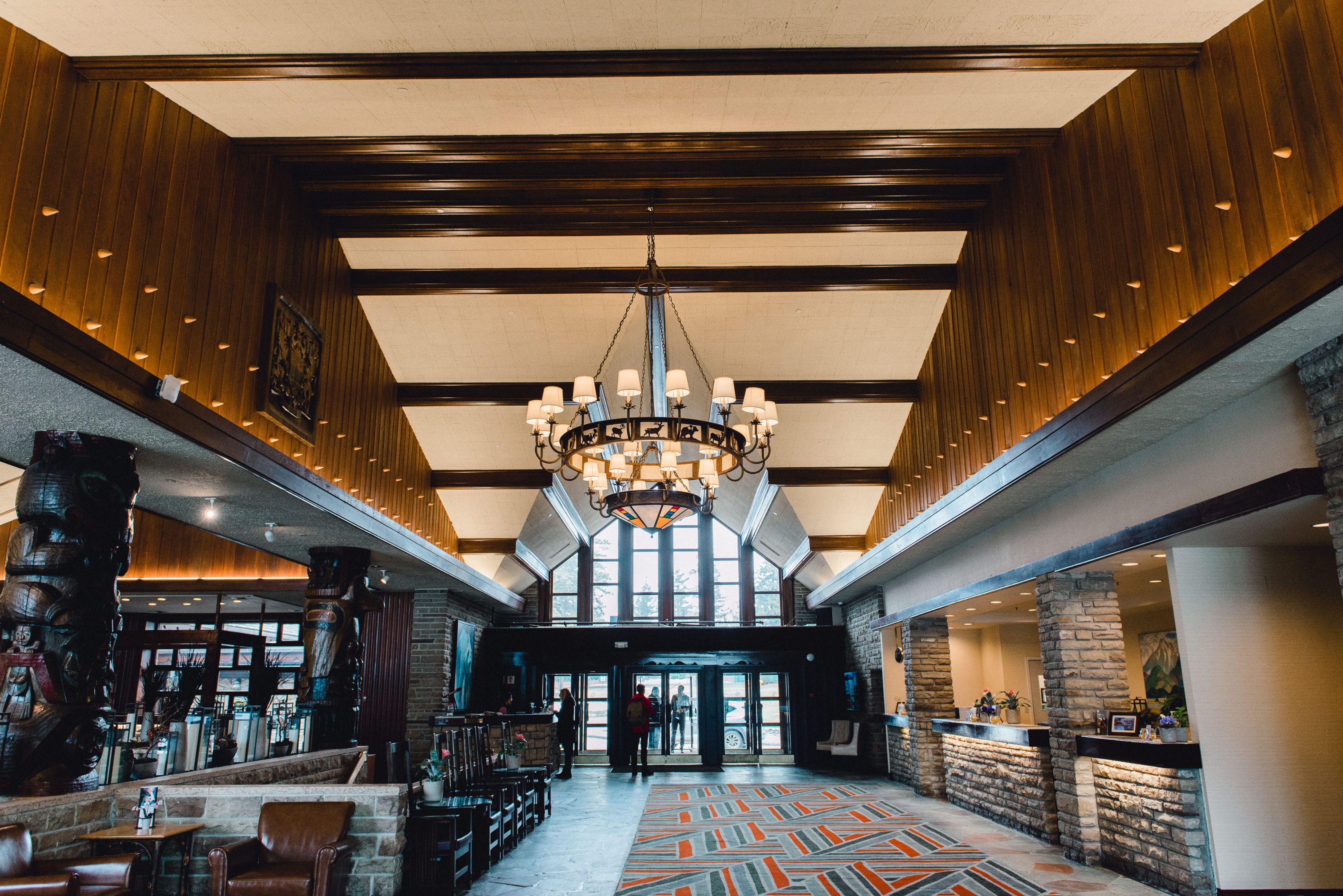 a large building with a chandelier and a stone wall