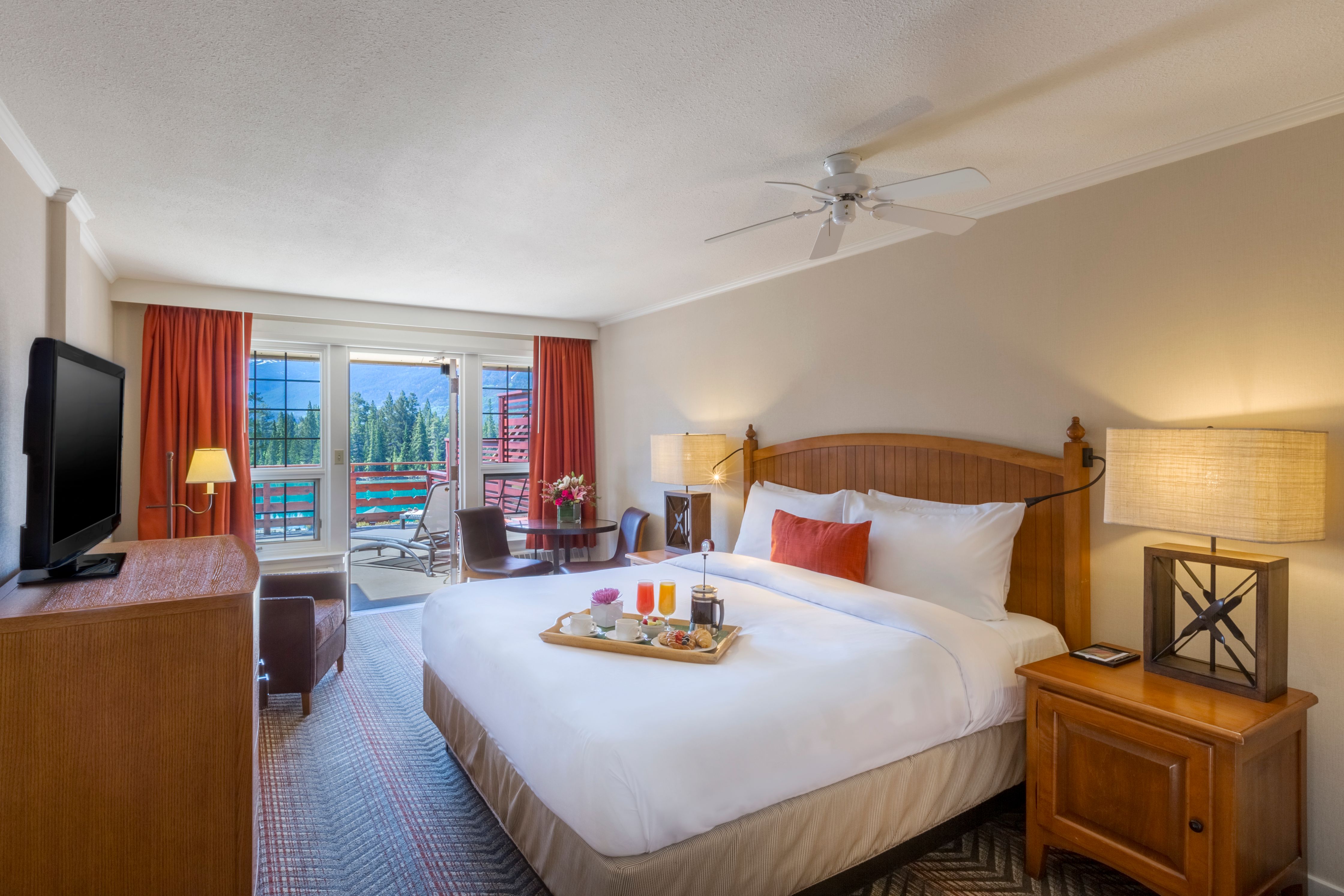 a bed with tray of food on it