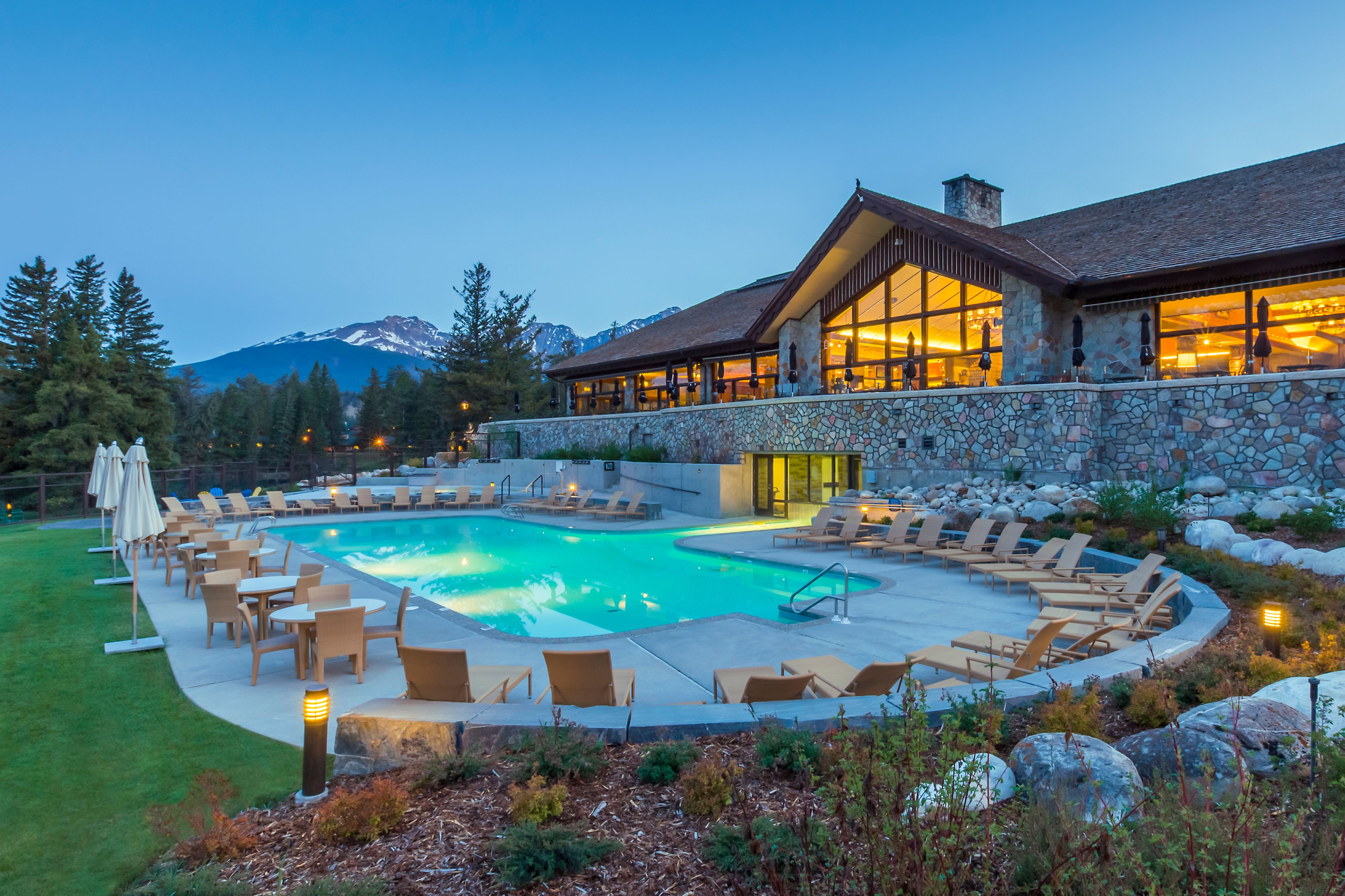 a pool with chairs around it