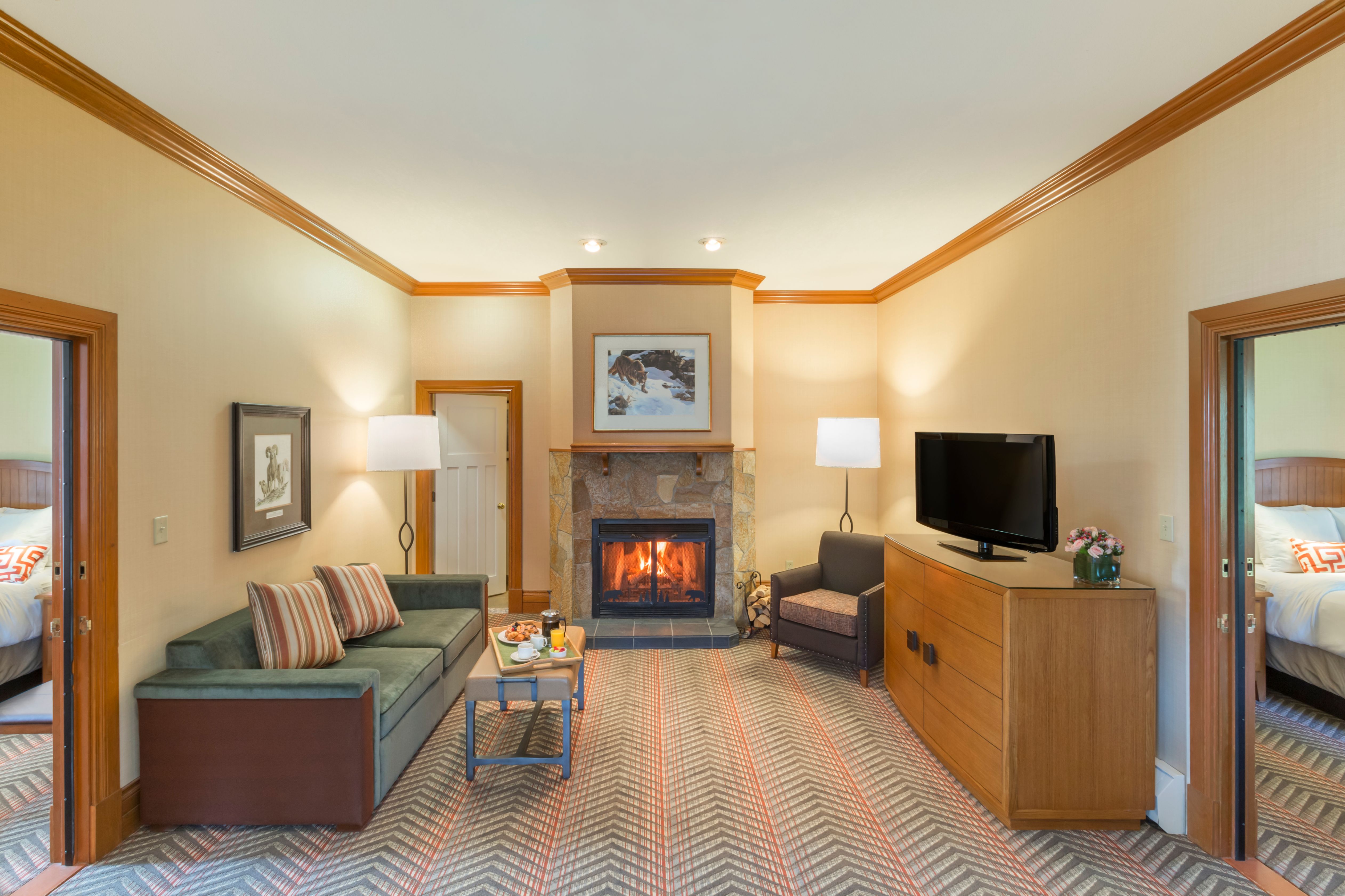 a living room with a fireplace and couch