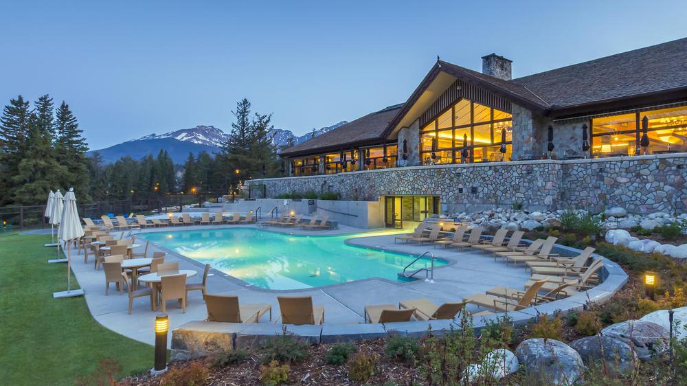 a pool with chairs around it