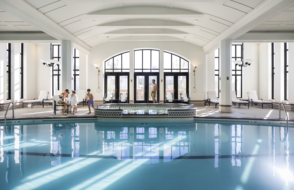 a group of people standing in a swimming pool
