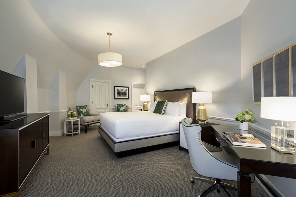 a room with a bed and a desk