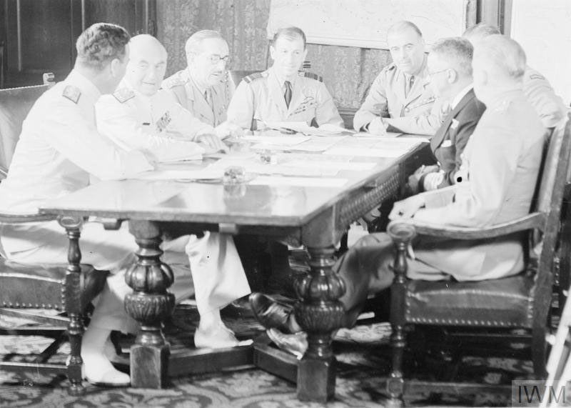 a group of men sitting around a table