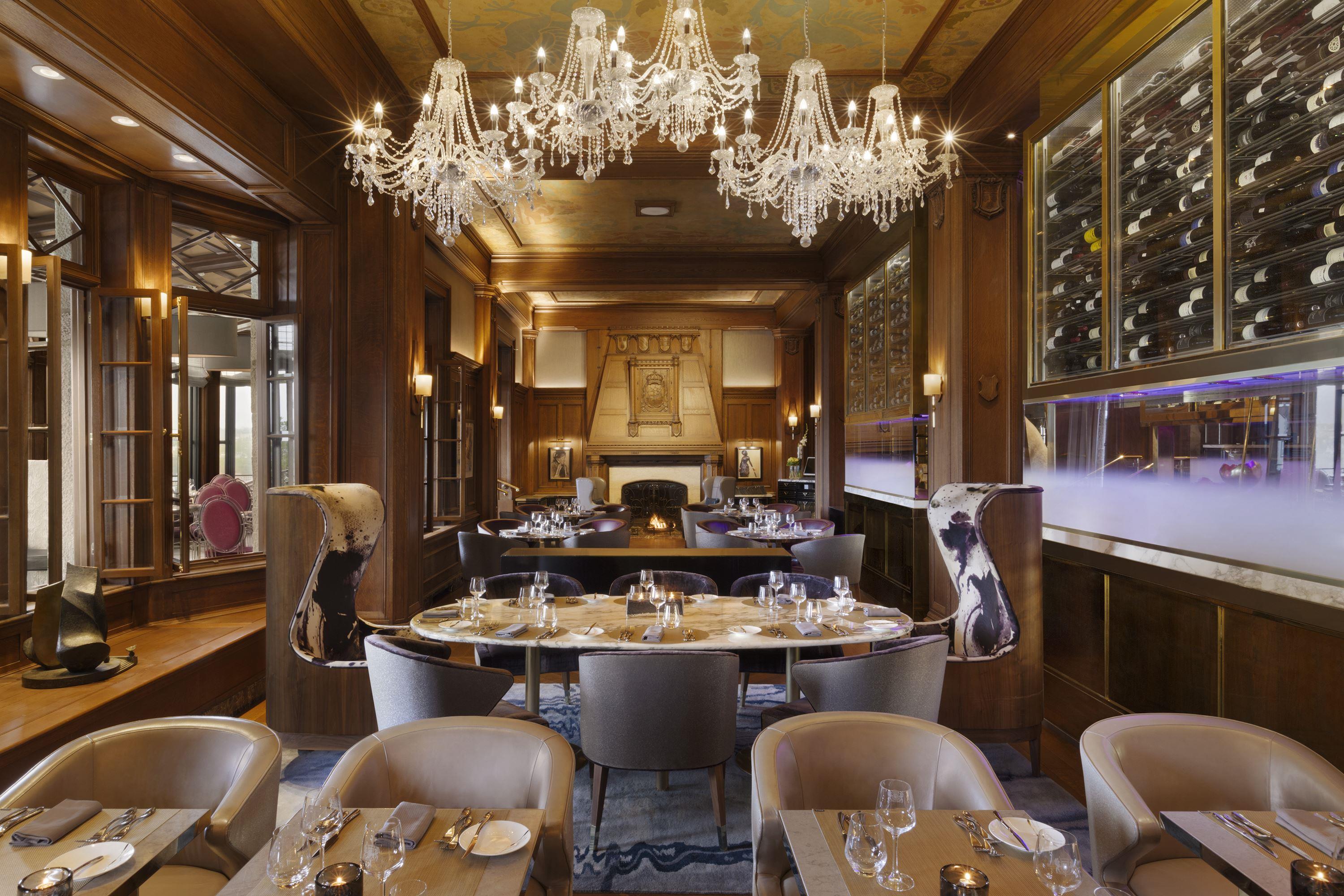 a restaurant with chandeliers and tables