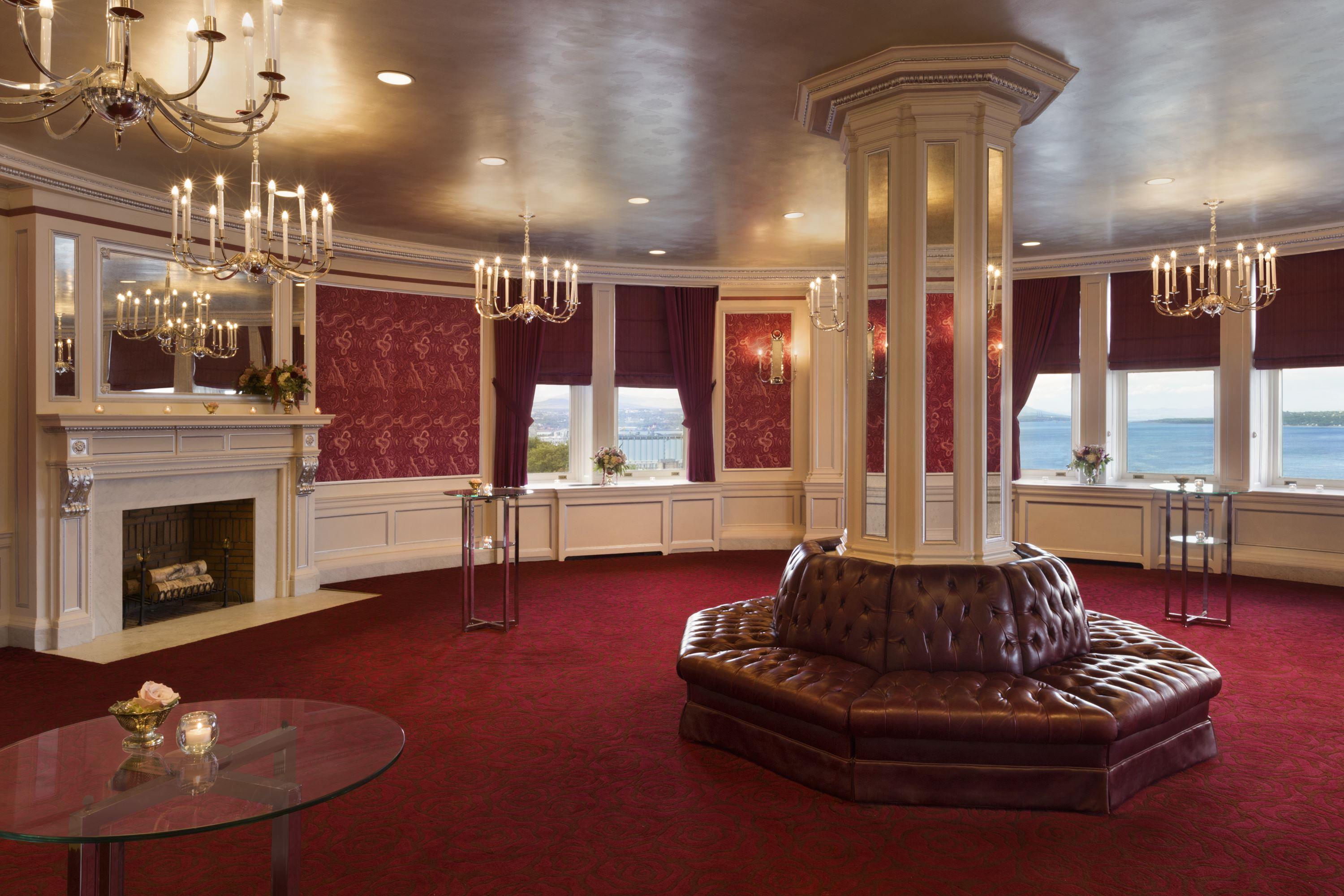 a room with a round table and a round pillar