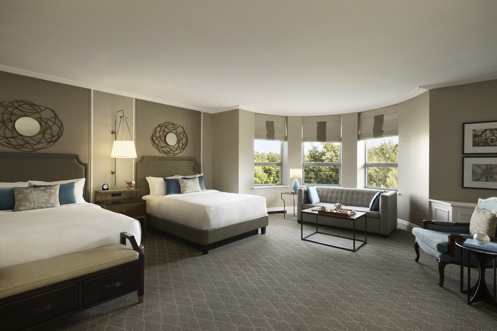a room with two beds and a couch