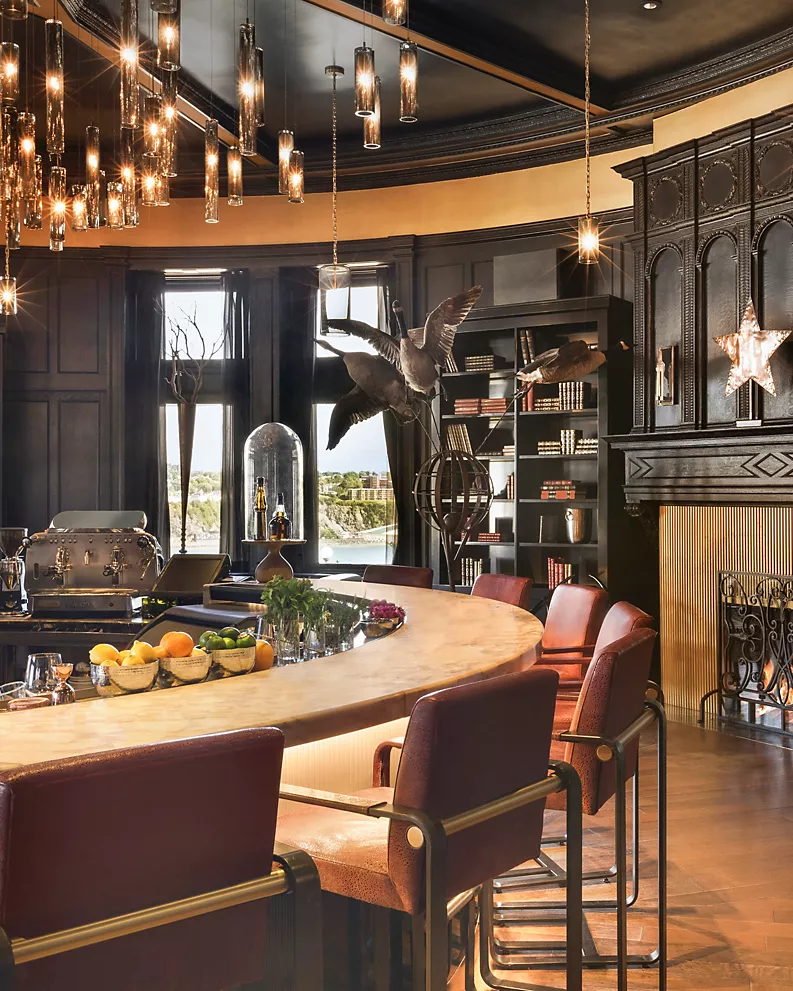 a room with a large table and chairs