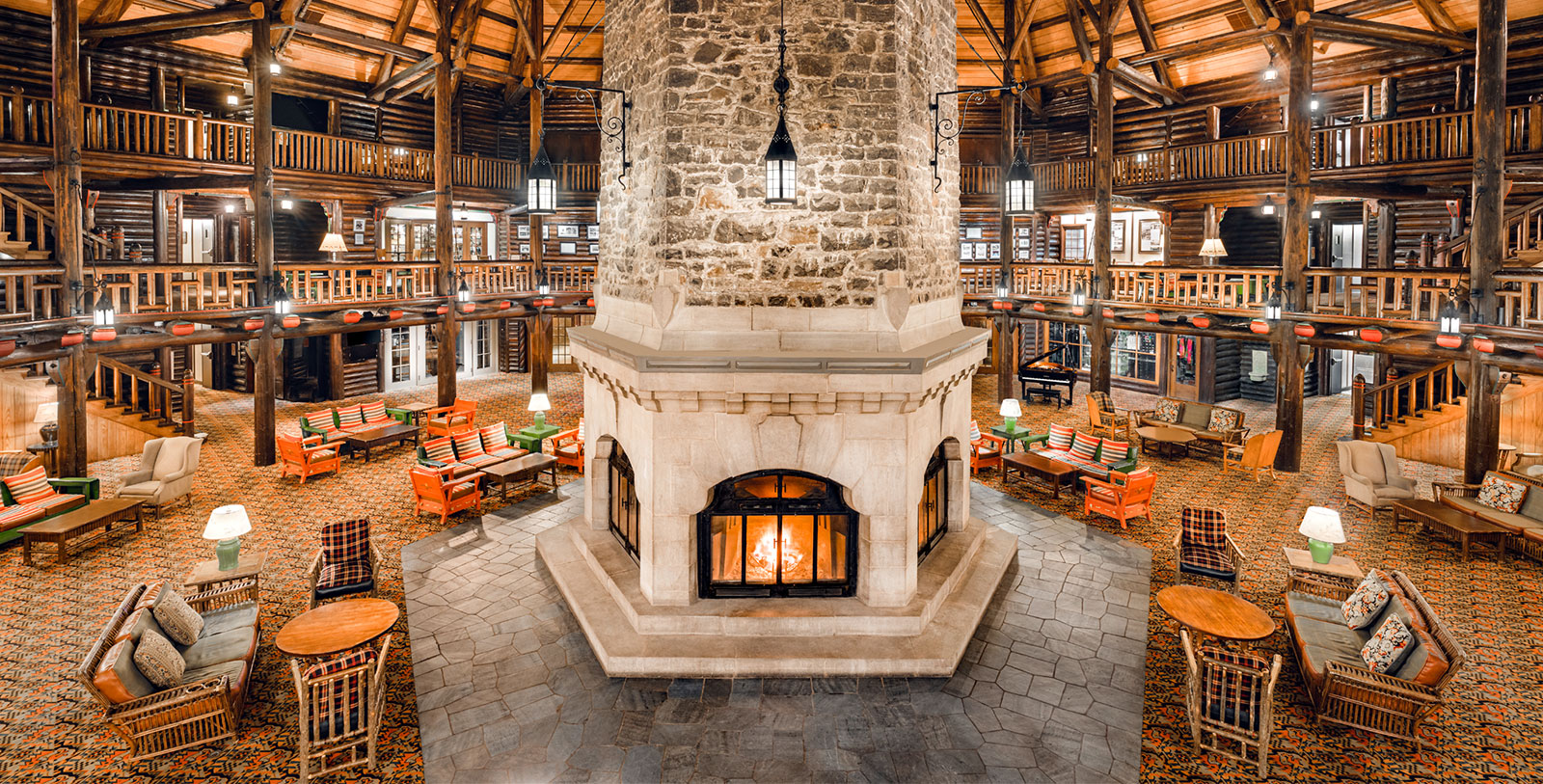 a large stone fireplace in a large room