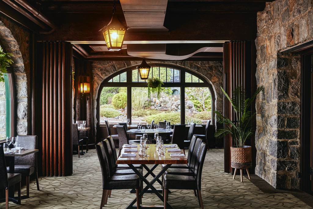 a restaurant with a table and chairs