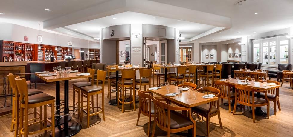 a restaurant with tables and chairs