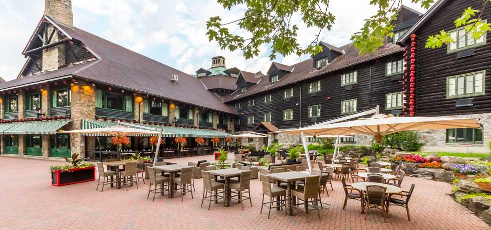 a courtyard with tables and chairs