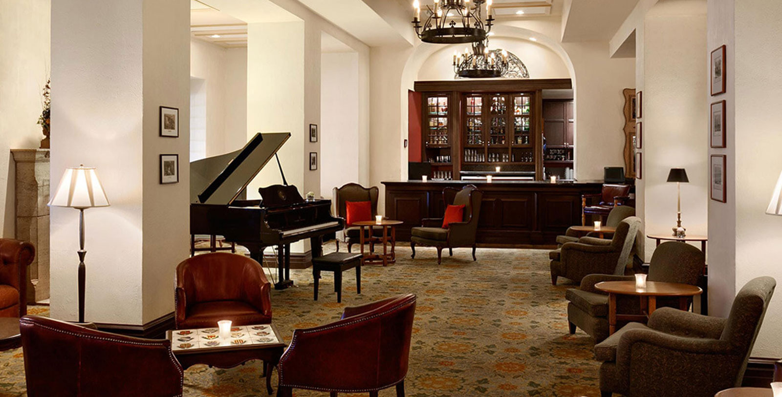 a room with a piano and chairs