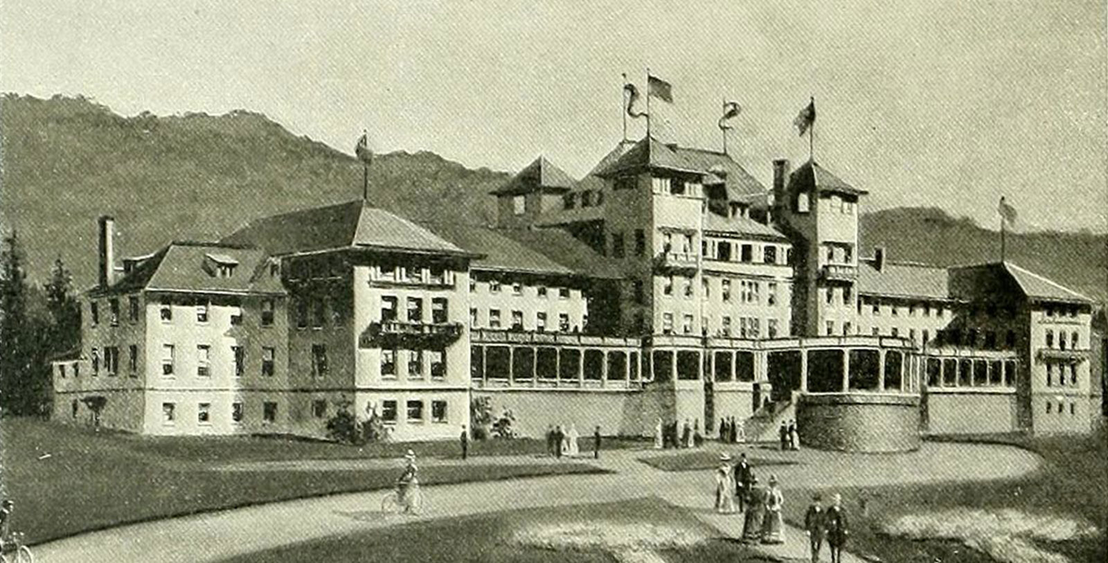 a large building with flags on top