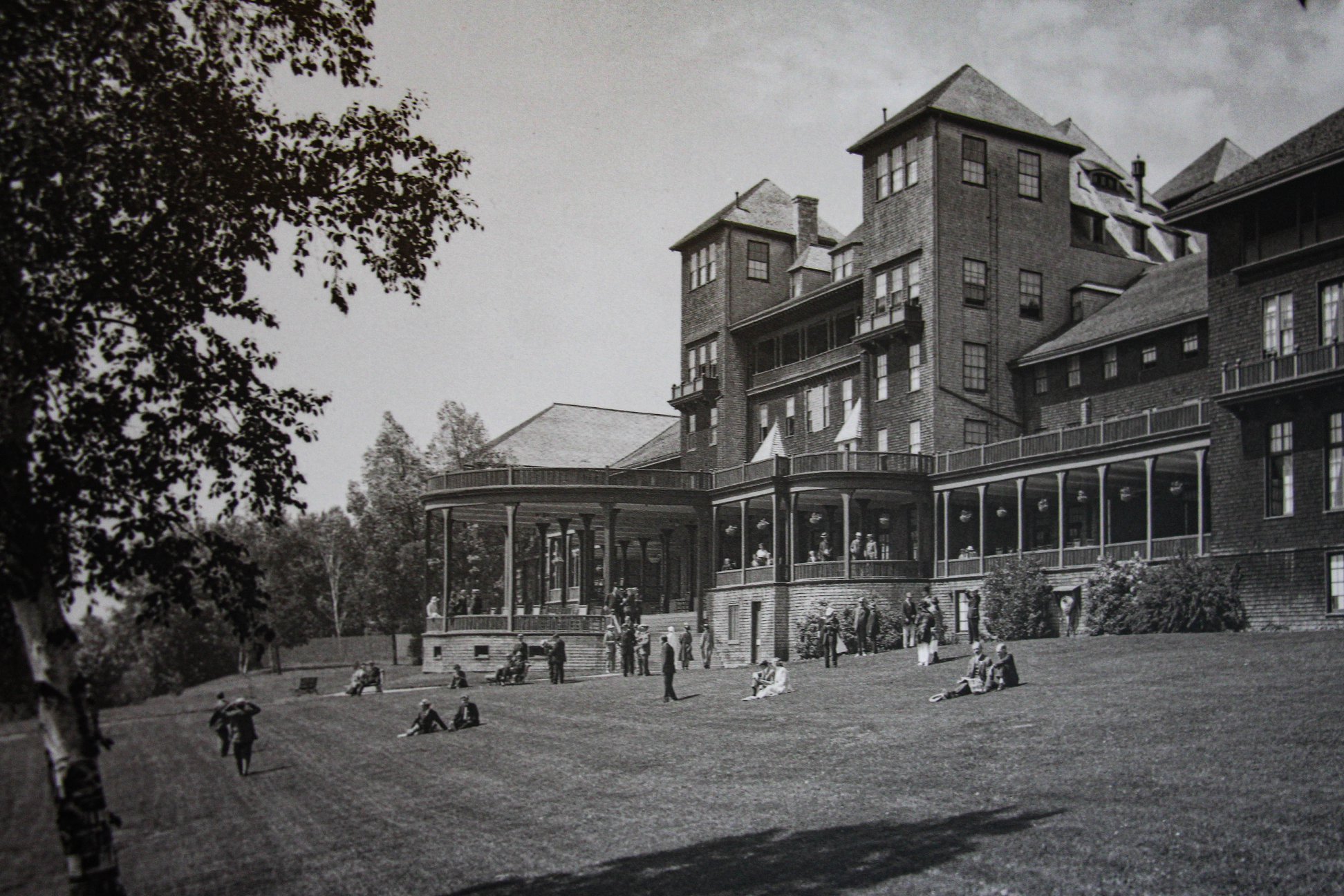 a large building with people on grass