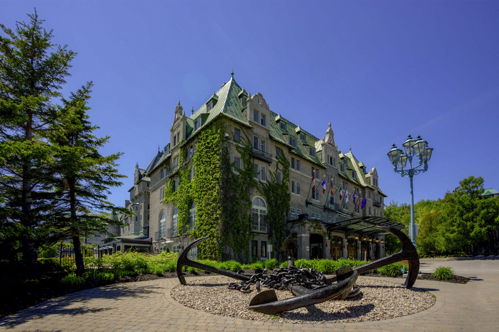 a large anchor statue in front of a building