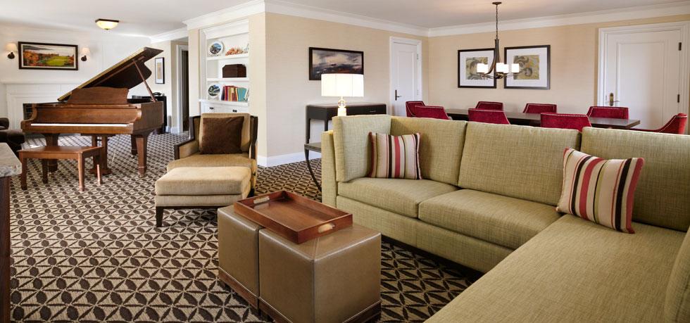 a living room with couches and chairs