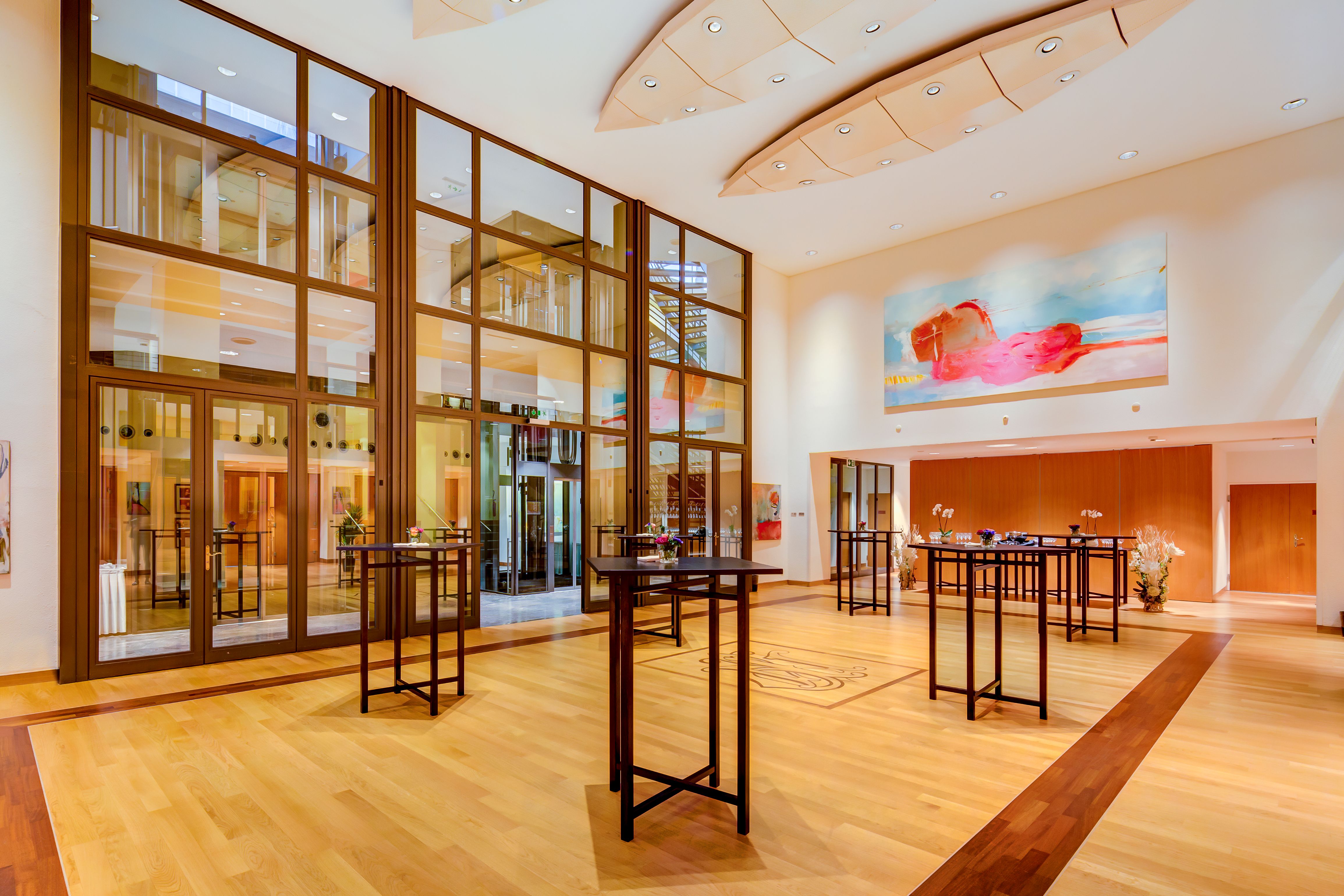 a room with glass walls and tables