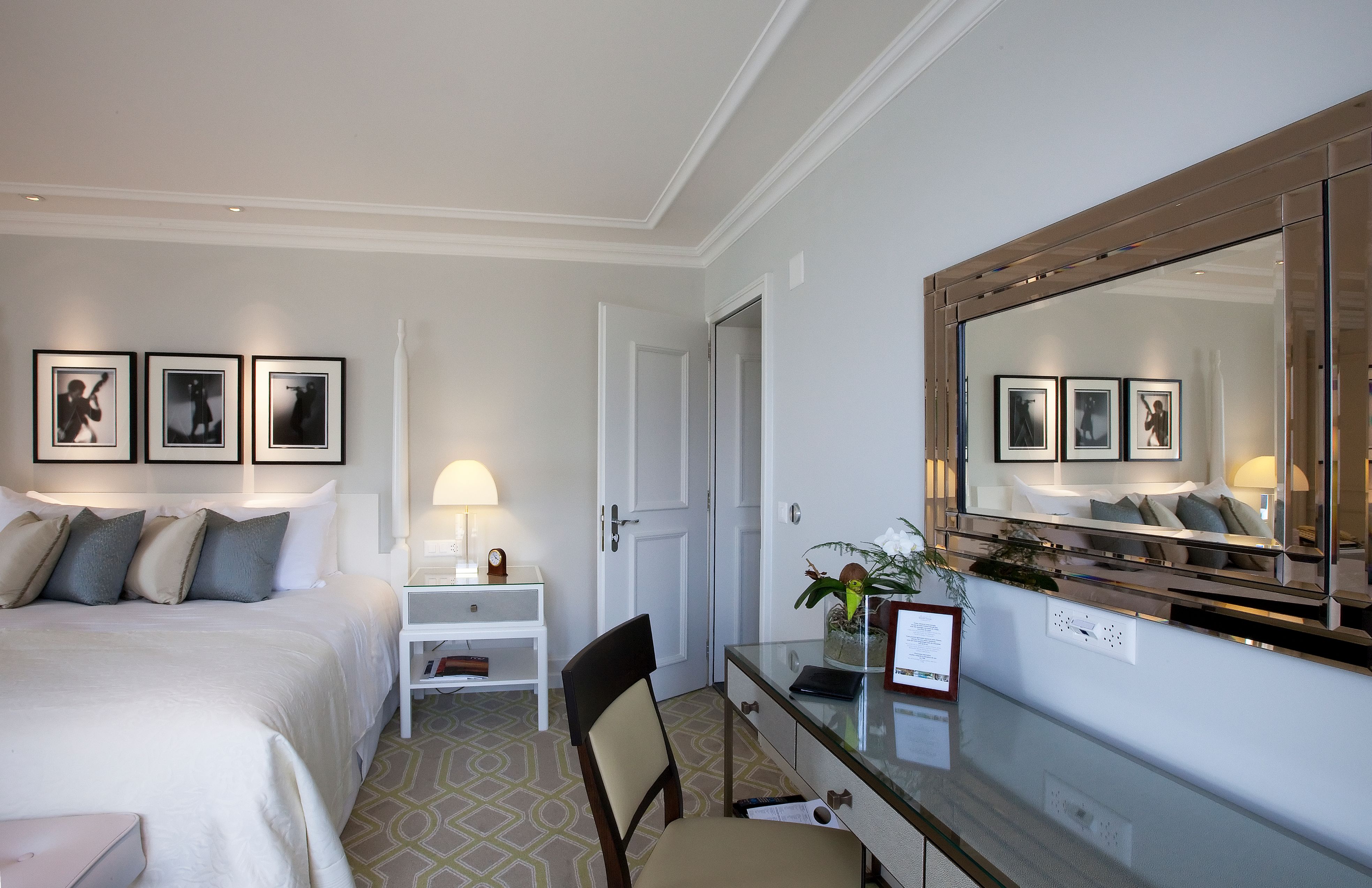 a bedroom with a bed and a desk