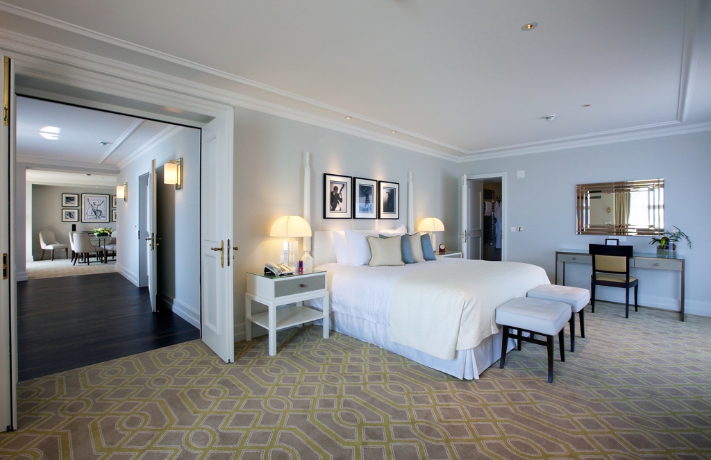 a bedroom with a bed and a table