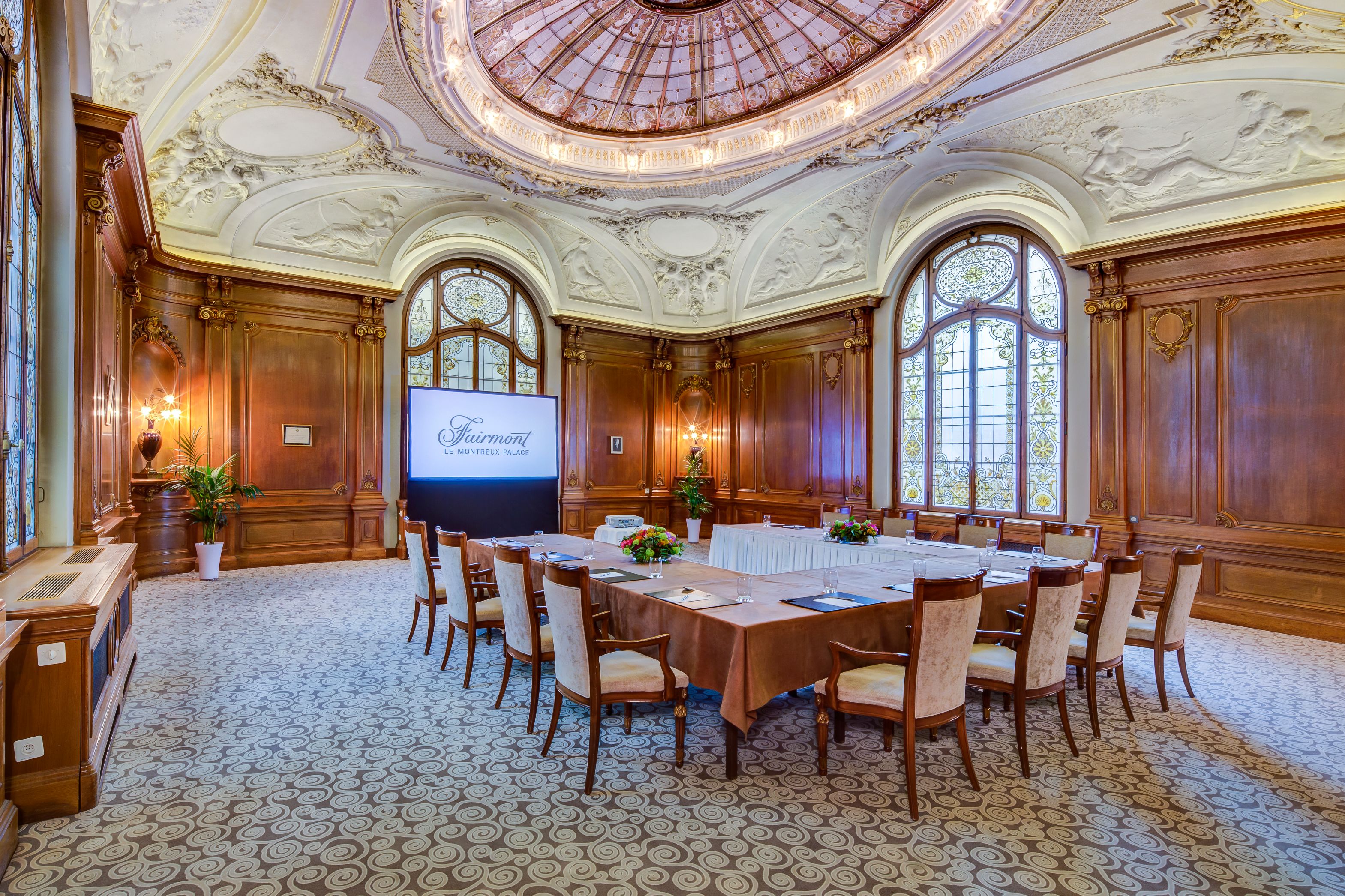 a room with a large table and chairs
