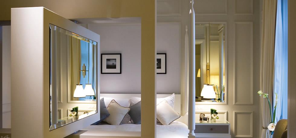 a bedroom with a mirror