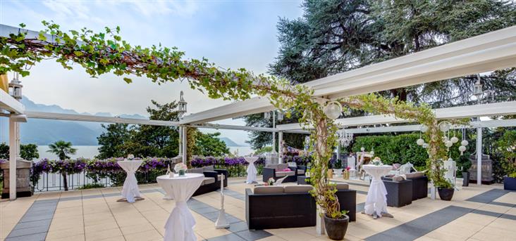 a patio with tables and chairs