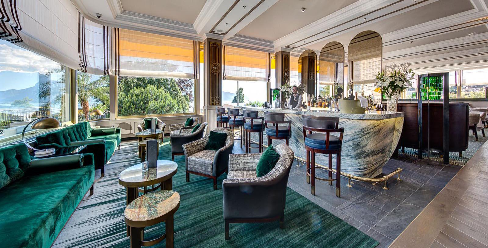a room with a bar and chairs