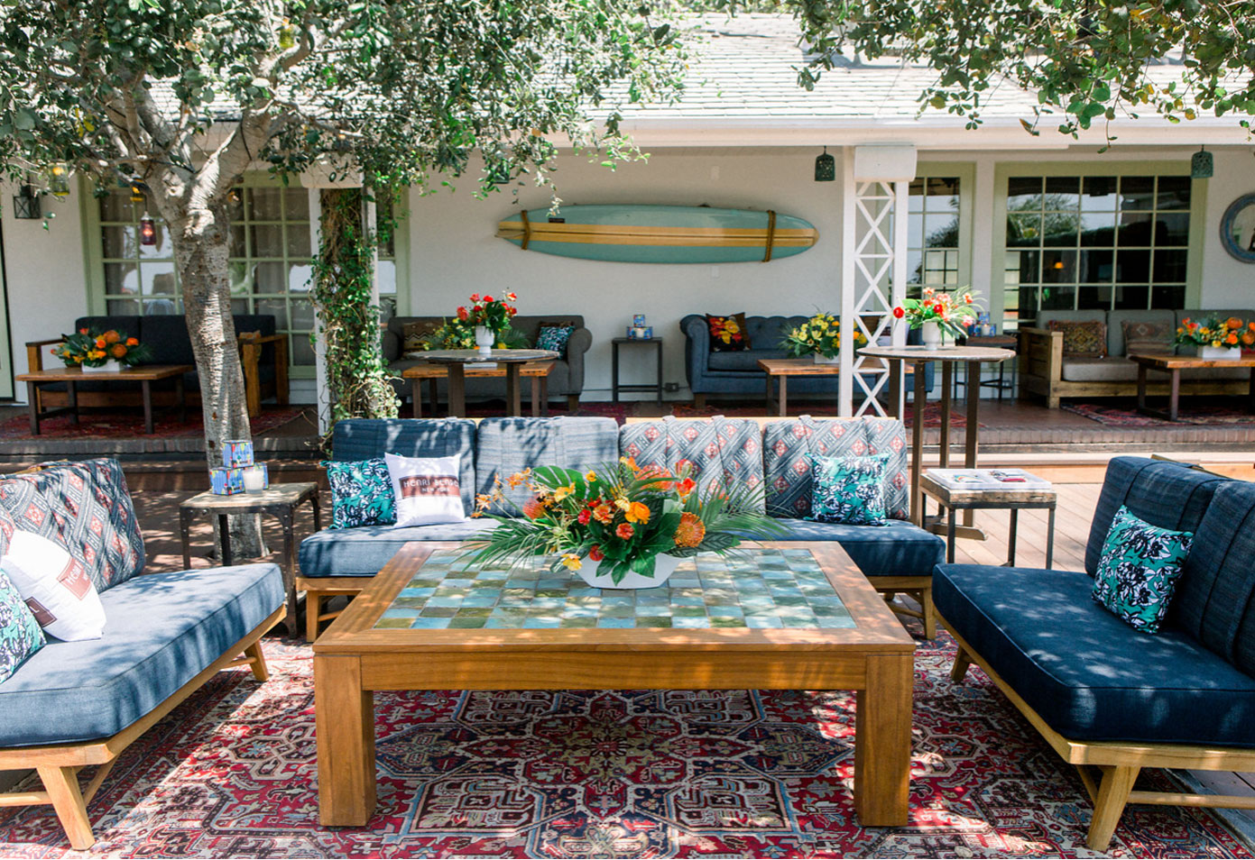 a patio with a table and couches