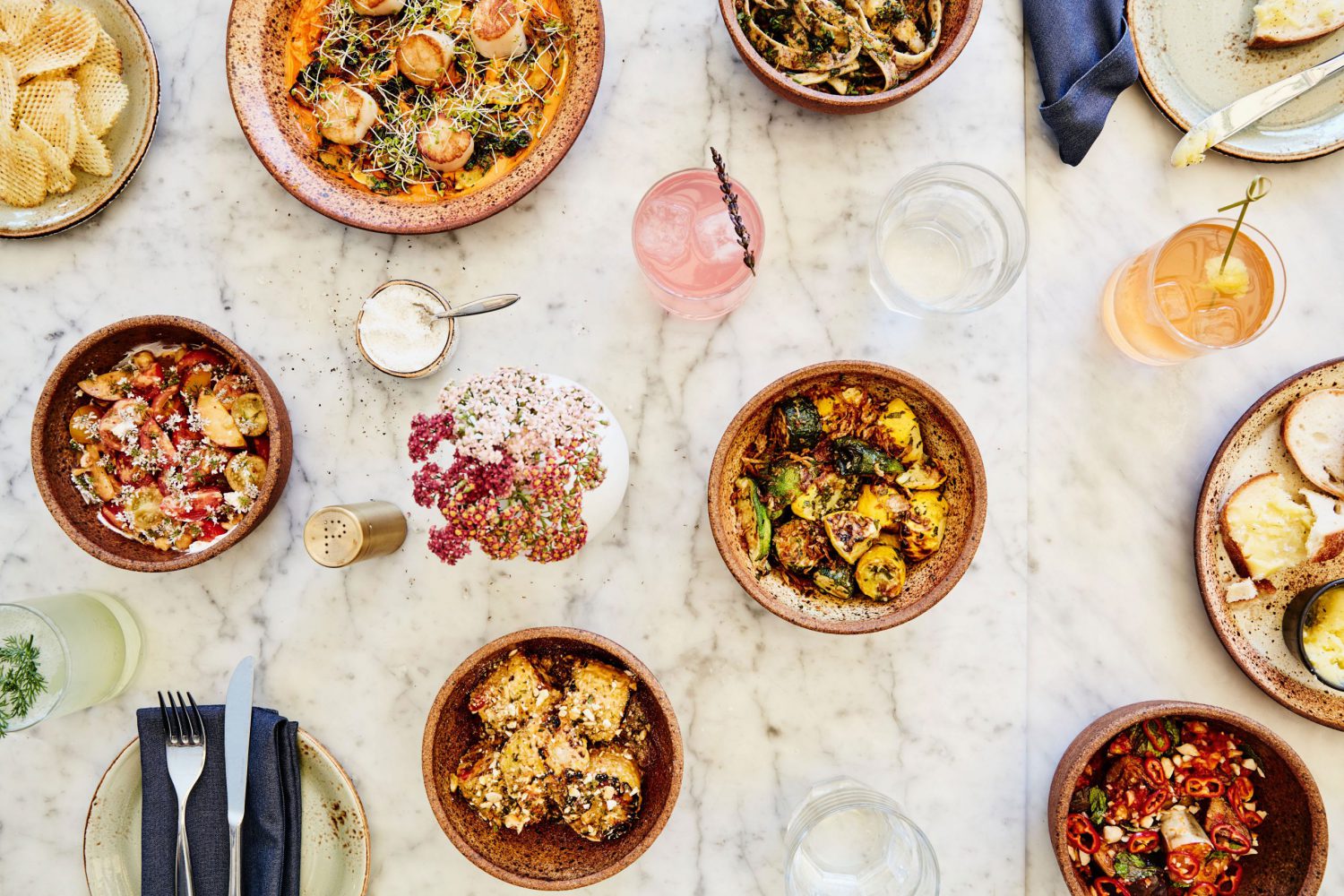 a table with bowls of food
