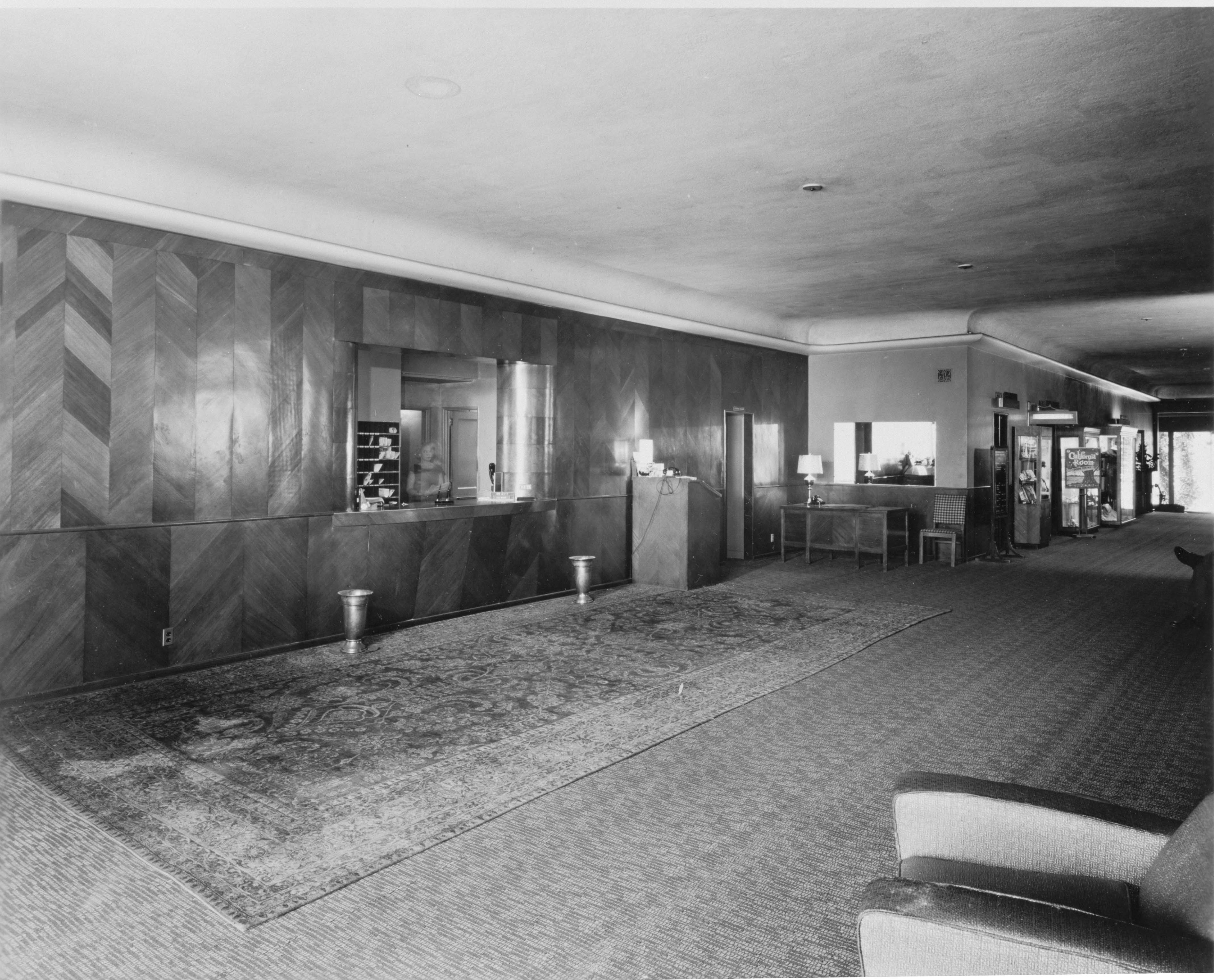 a room with a carpeted floor and a counter