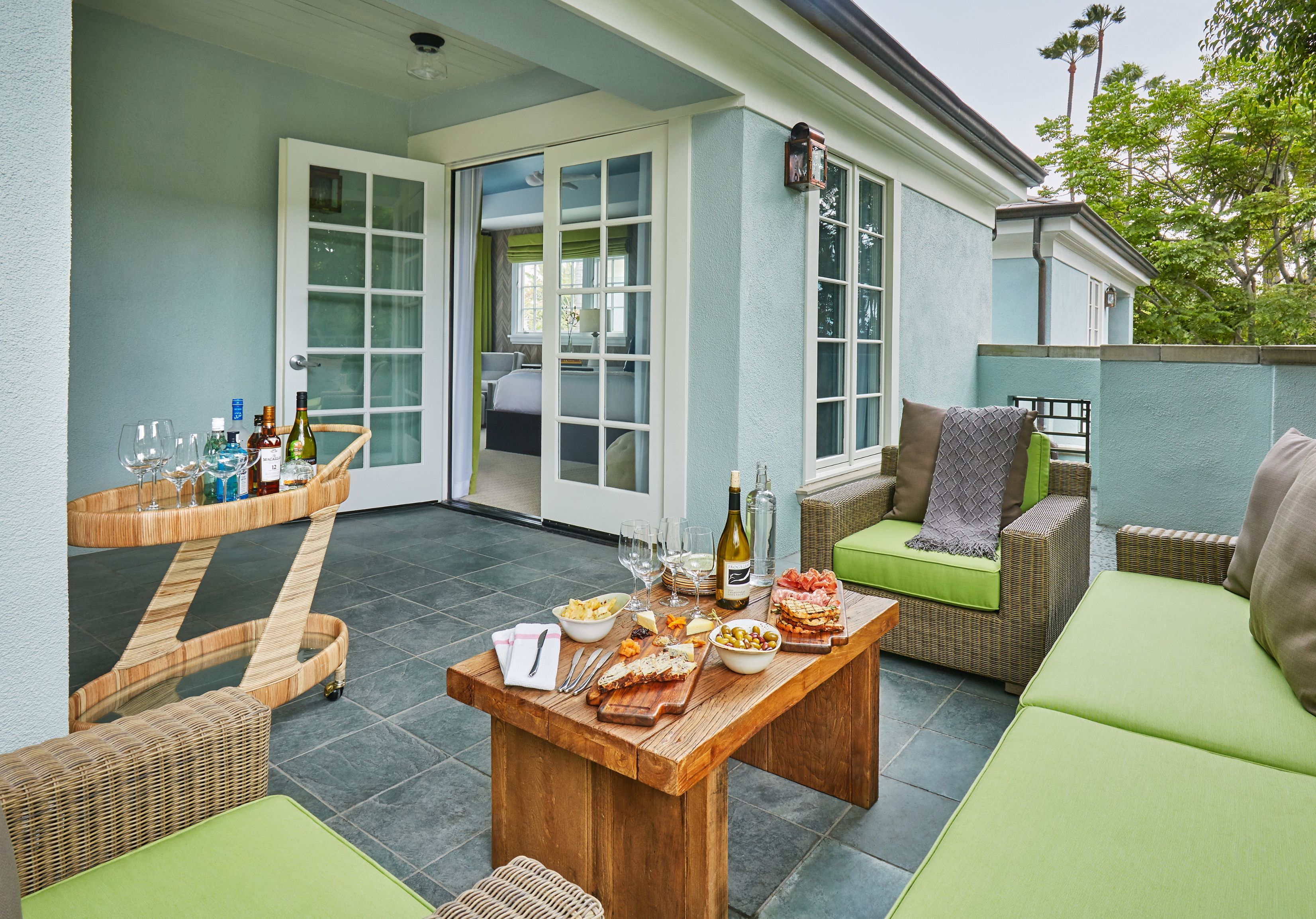 a table with food on it and chairs on a patio