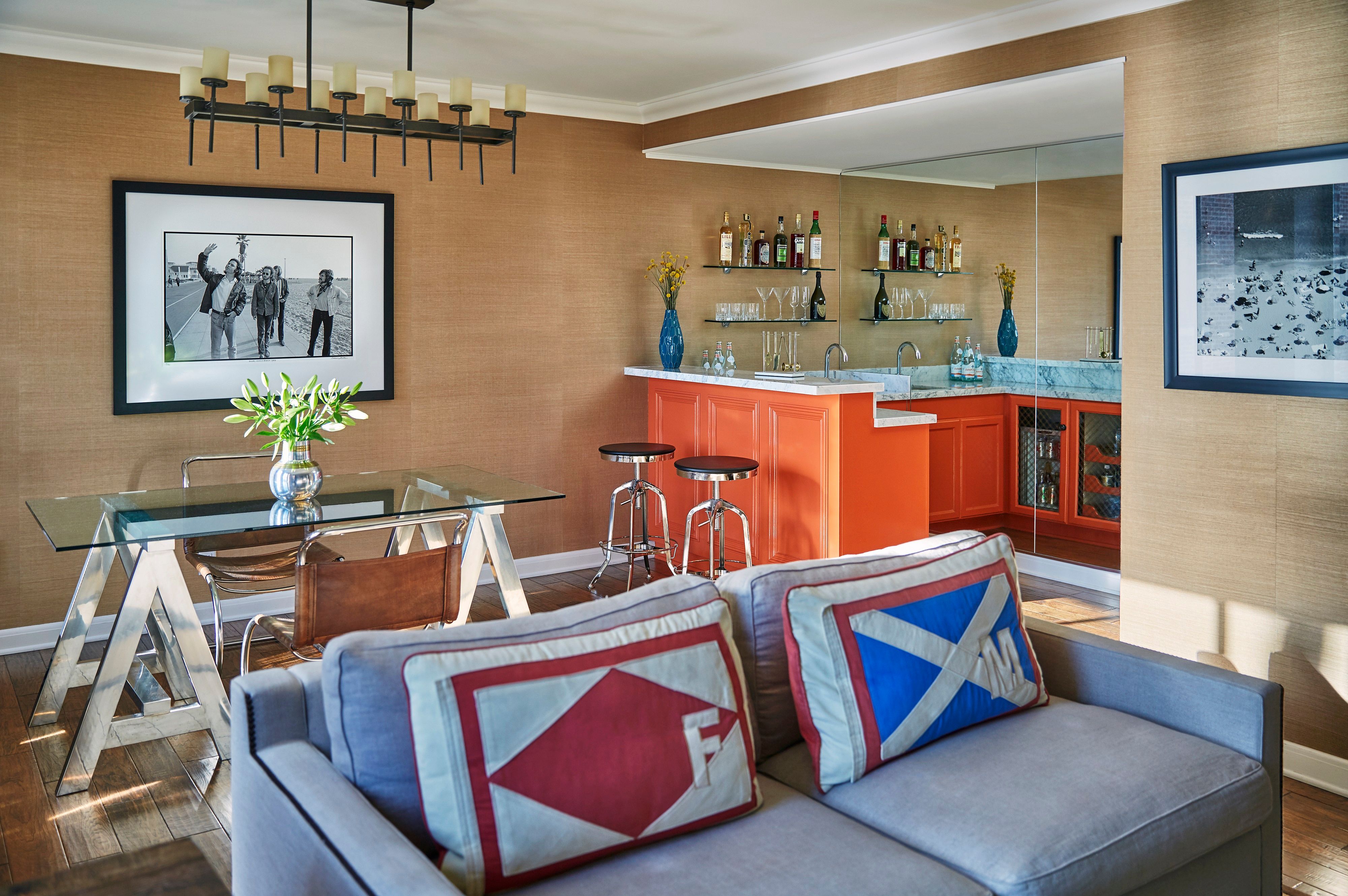 a living room with a couch and kitchen