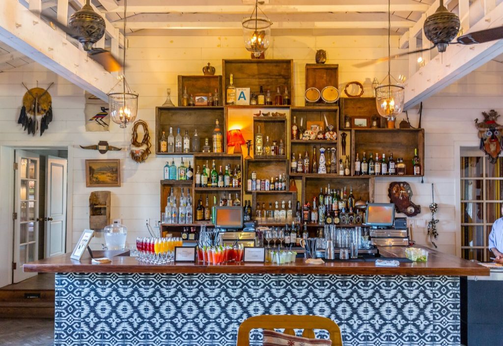 a bar with bottles and glasses on it