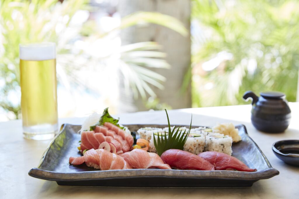 a plate of sushi and sashimi