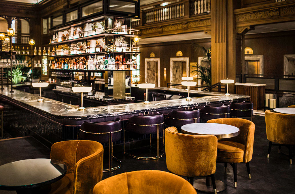 a bar with chairs and tables