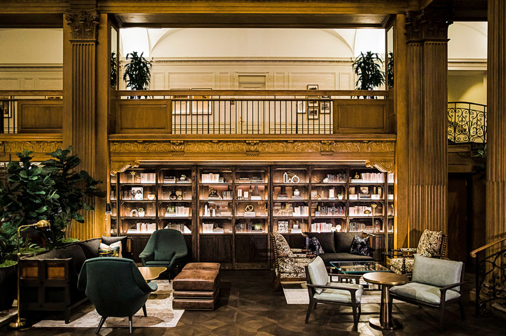 a room with a library and bookshelves