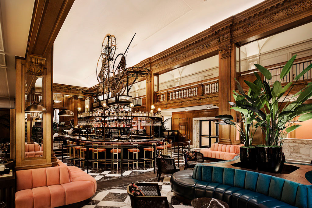 a room with a bar and a large table