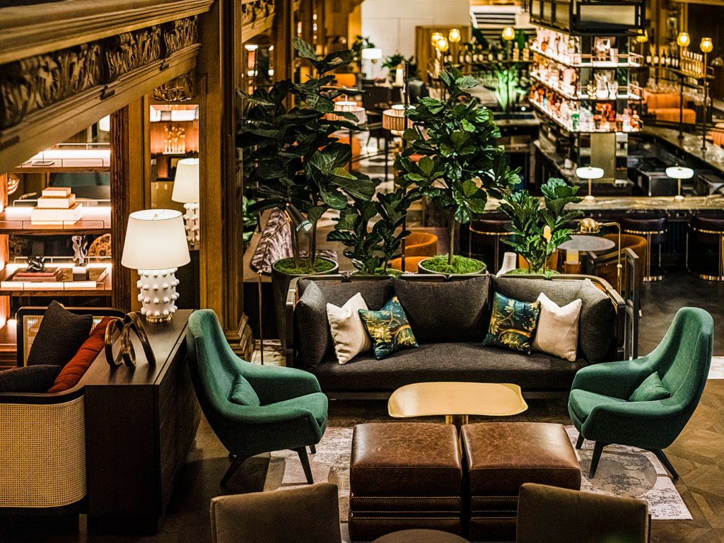 a room with a couch and chairs
