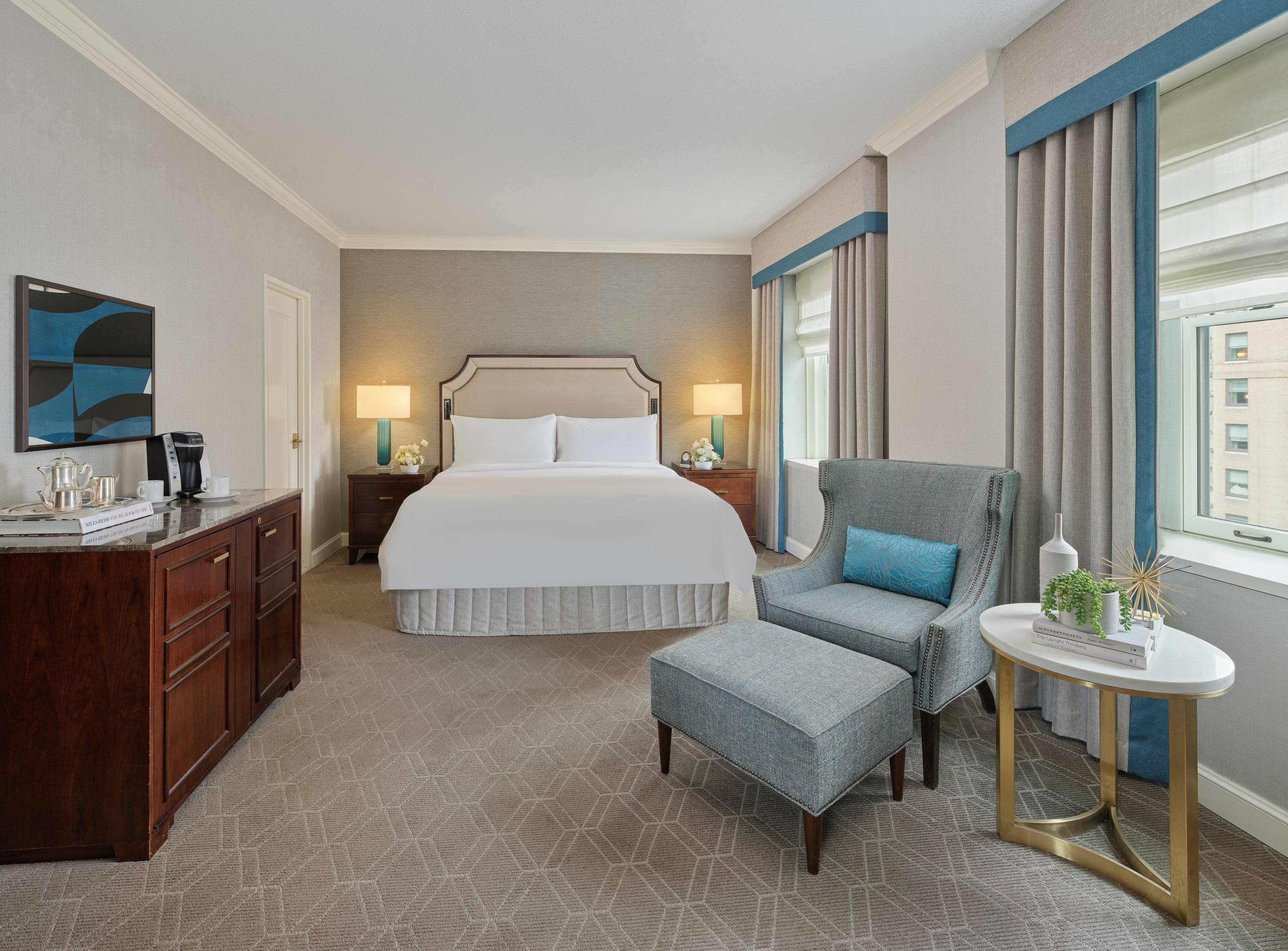 a bedroom with a bed and a chair