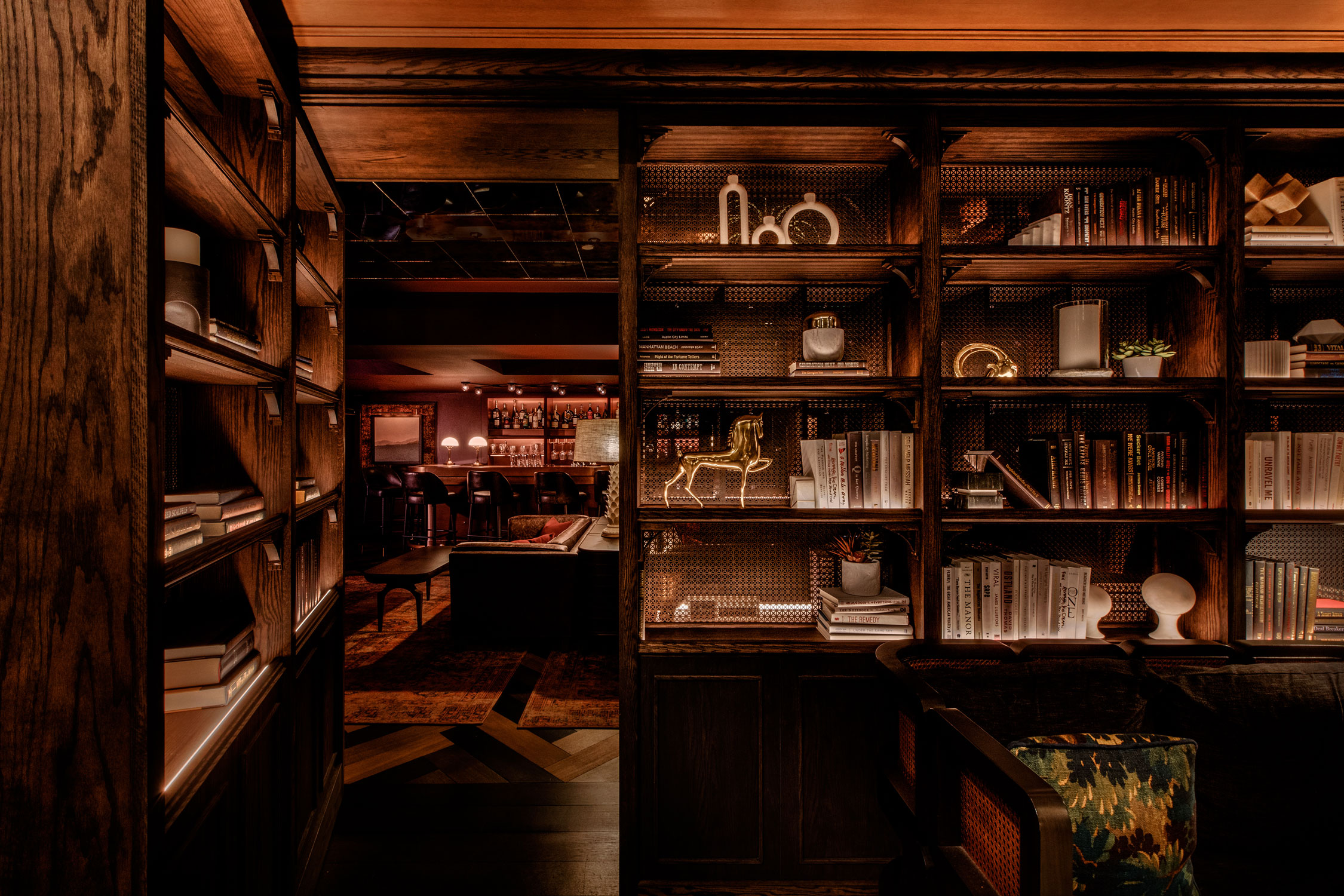 a room with a bookcase and a couch