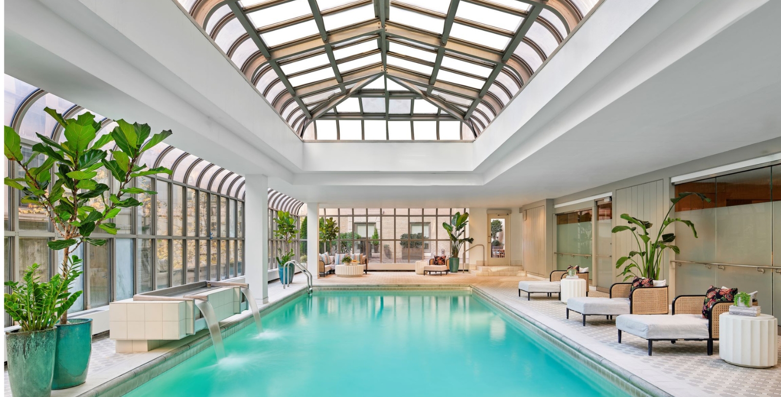 a indoor pool with a glass roof