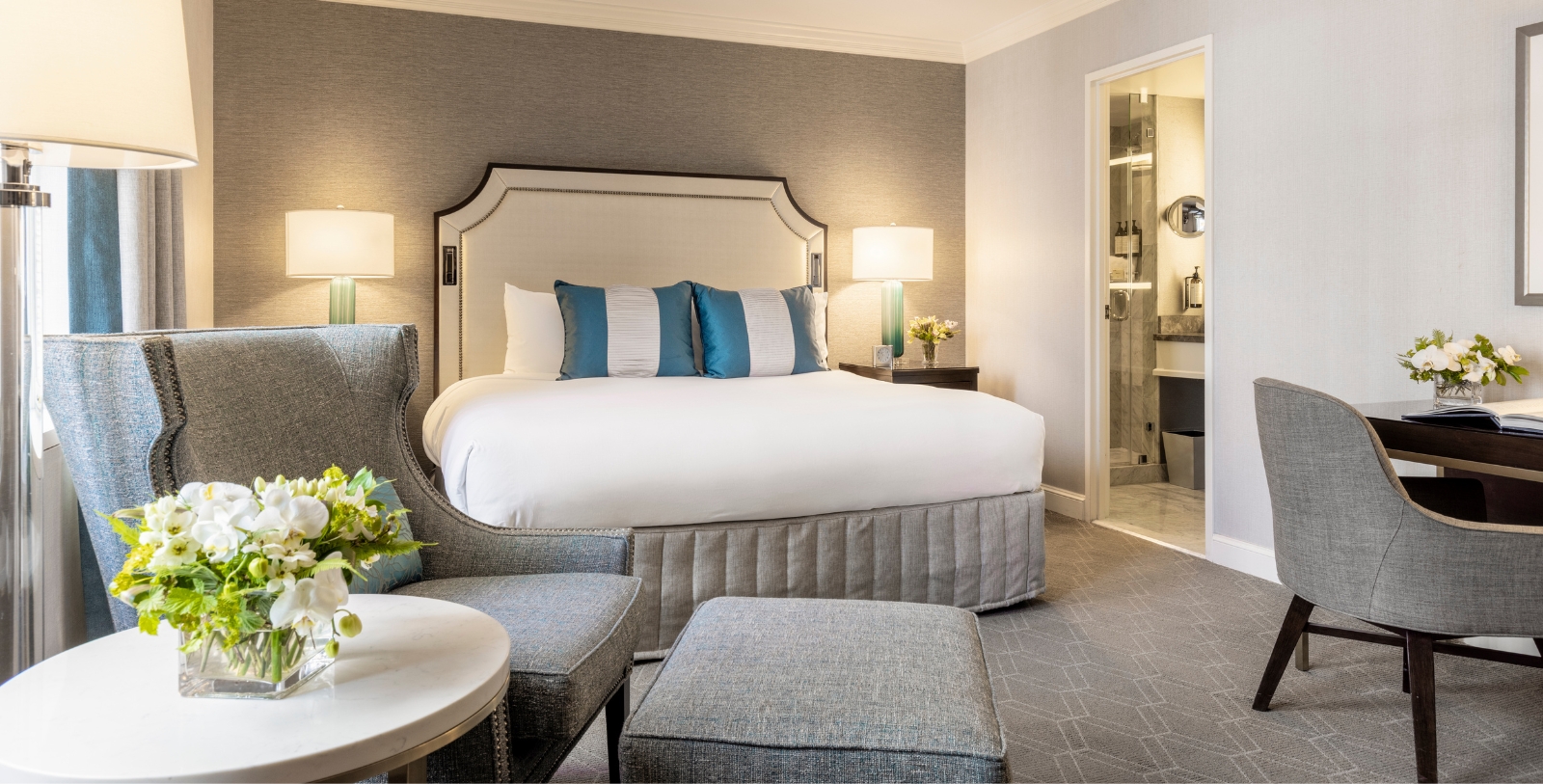 a bedroom with a bed and a shower