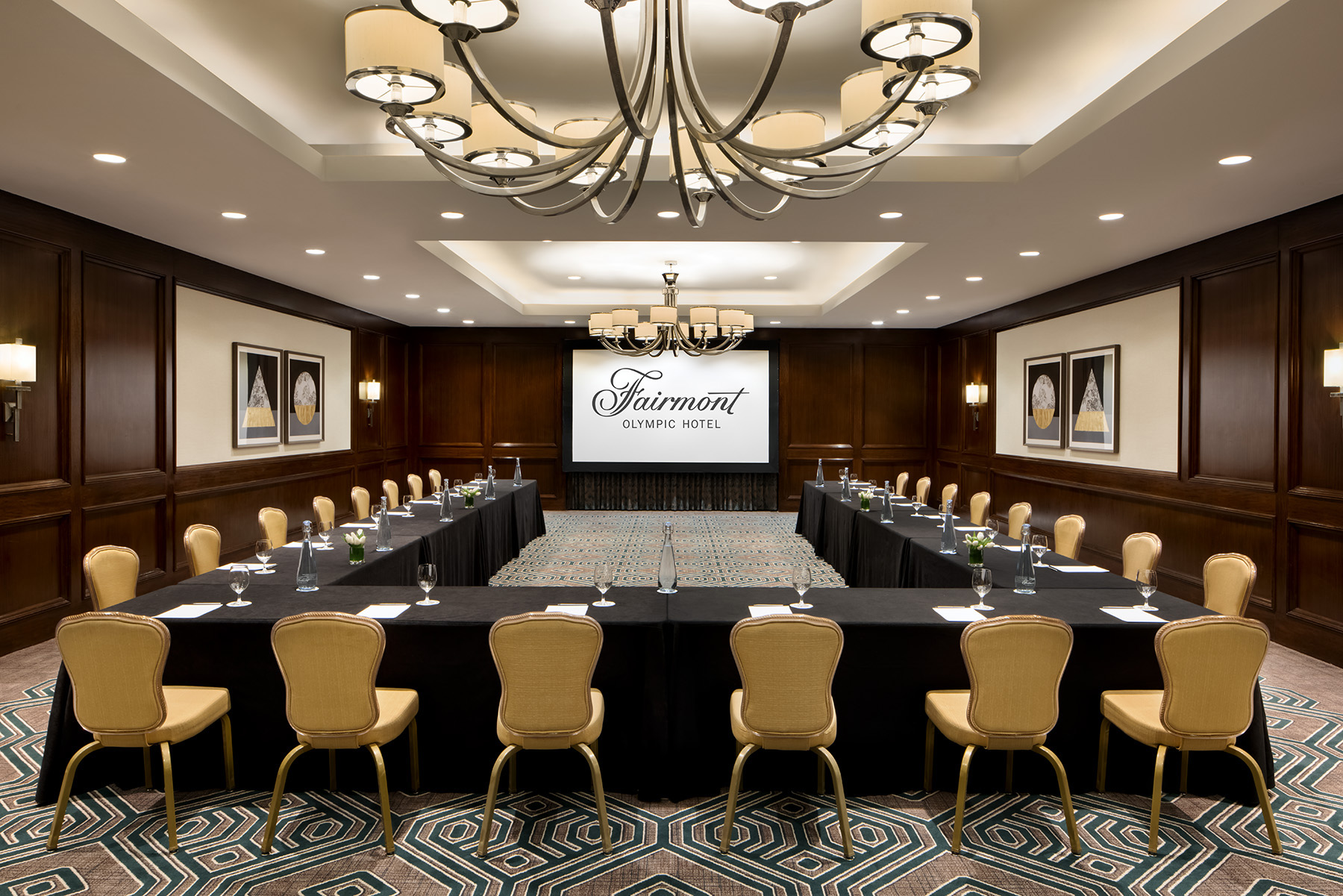 a room with a large table and chairs